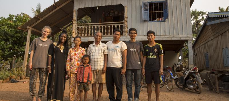 Volunteers with host family in Cambodia