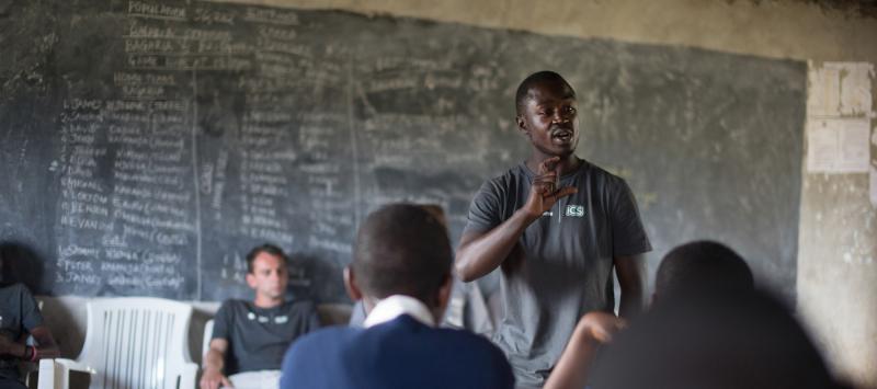 A Balloon Ventures volunteer talks to students at Bagara Secondary school in Njoro