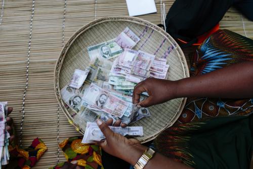 Counting money in Mozambique
